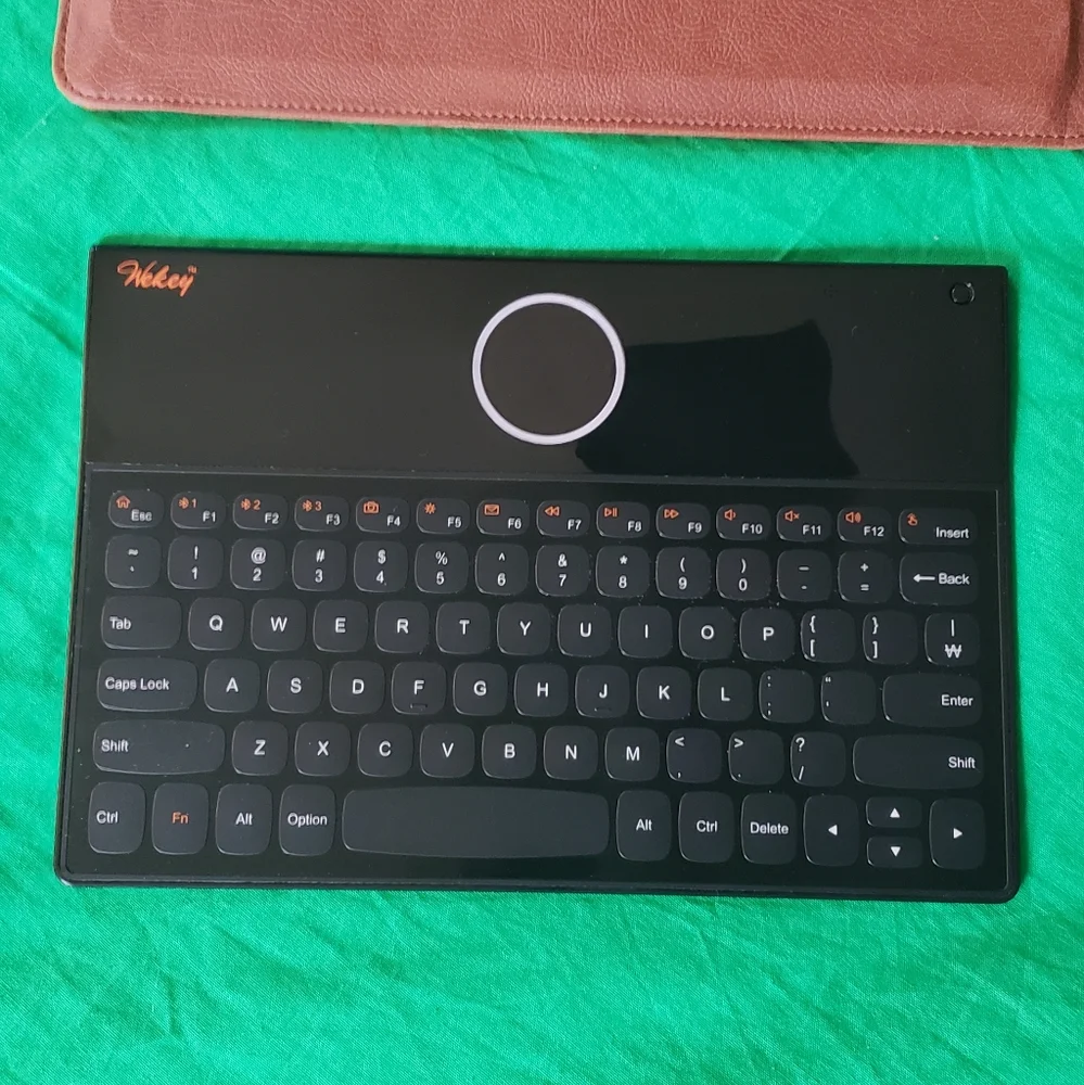 Wekey Bluetooth Super Slim Touch Keyboard with Leather Case USB Cable Manual